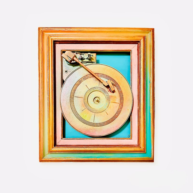 Spray-painted turntable assemblage in a gold frame